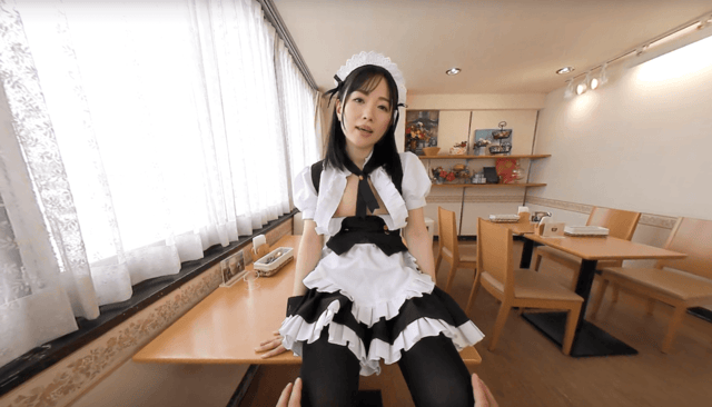 Tsubasa Minami in a uniform poses for a 180 degree VR POV video filmed in a restaurant setting.