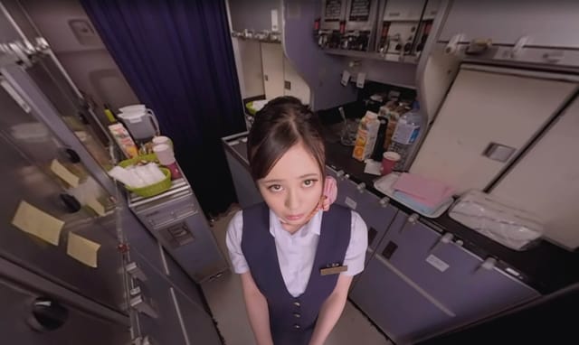 Brunette model in a flight attendant uniform teases the viewer during a POV VR blowjob and grinding scene in a plane cabin.