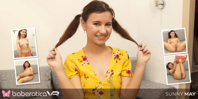 Sunny May with a ponytail touches her breasts in a solo Russian VR scene produced by BaberoticaVR