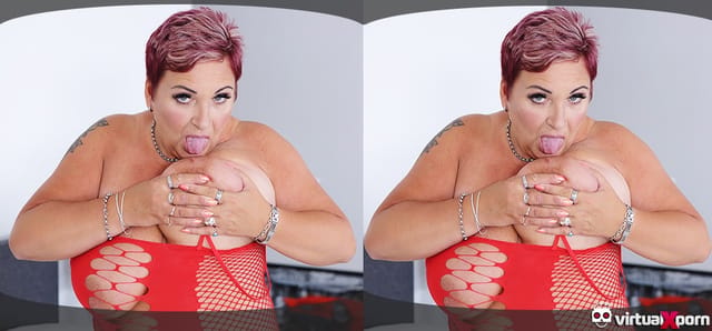 Mature redhead Joanna Crow performs a solo scene in 4K VR with big tits for VirtualXPorn