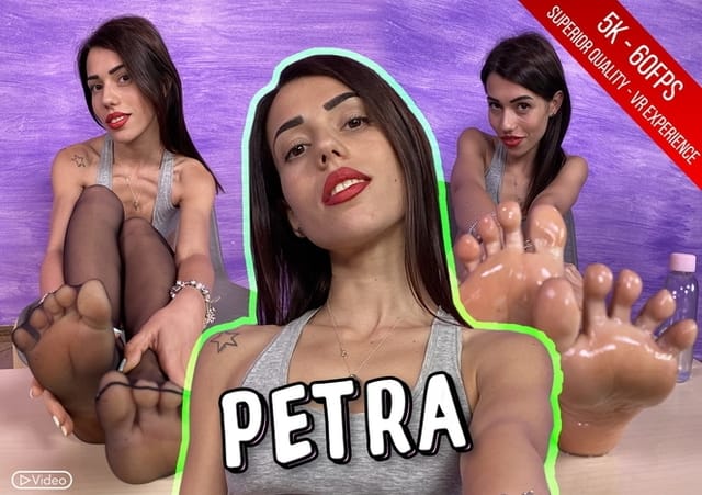 Brunette Petra massages oil onto her nylon-clad feet during this solo 4K VR foot fetish production.