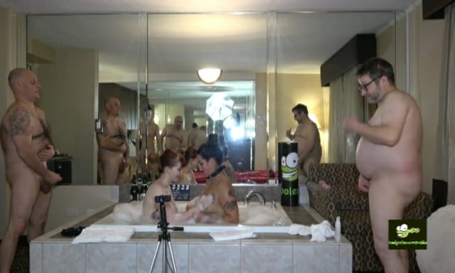Hannah Grace and Misty Meaner perform a lesbian scene with voyeurs in 4K VR footage.