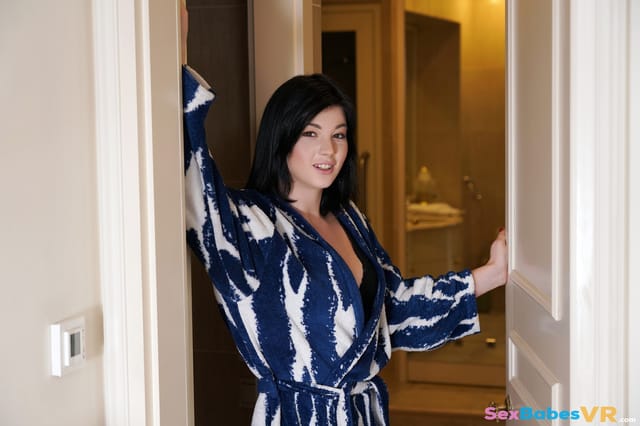 Nessie Blue performs a POV blowjob in a home setting for SexBabesVR, featuring 4K resolution and 60 FPS playback.