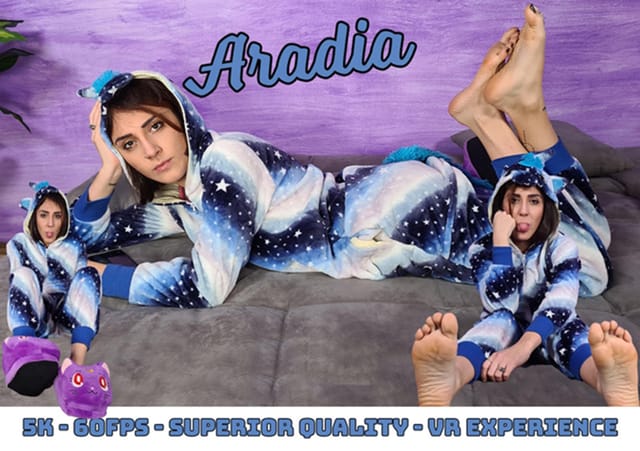 Aradia wears a hooded one-piece pajama and purple slippers in this 4K non POV VR solo fetish video by VRFootFetish