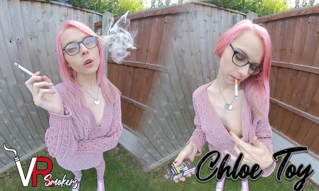 Model Chloe Toy smokes in an outdoor garden setting, captured in a non-POV VR video with 60 FPS premium quality.