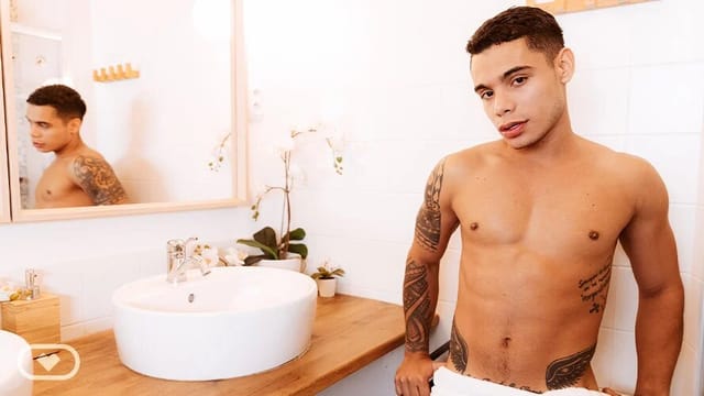 Randy Junior performs solo anal masturbation in a bathroom setting captured in high definition VR POV quality.