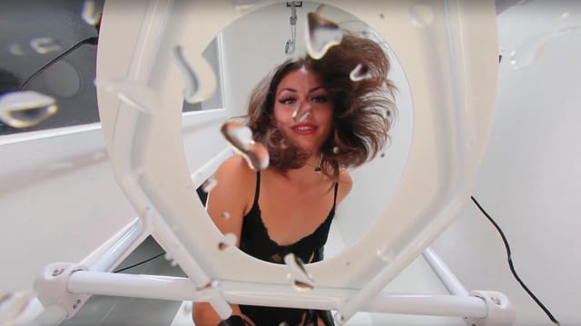 Brunette Goddess Lush in a solo femdom scene dominates a piss bucket in a VR cam setting filmed in 4K and 60 FPS.