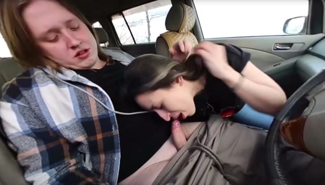 Blonde woman performing oral sex on a man in a parked car during the day in 4K POV VR.