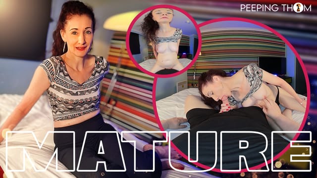 Mature model Scarlet performs a blowjob in a hotel room during a POV scene with 4K resolution and 60 FPS.