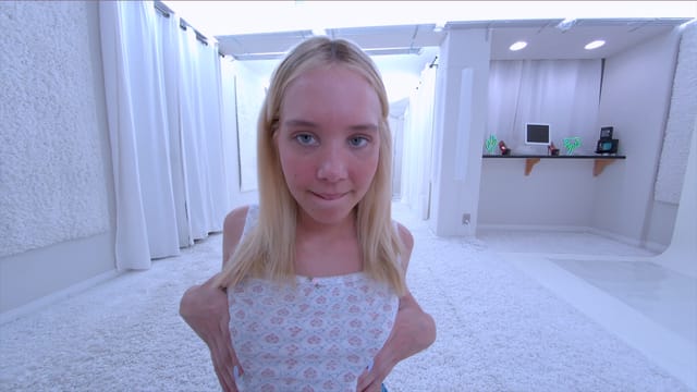 Blonde model Sophia Sterling strips solo in a white studio during a casting scene filmed in 4K VR POV.