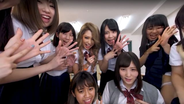 POV VR scene of a man masturbating alongside twenty-six women in a group setting, filmed in 4K resolution with 180 degree passthrough.