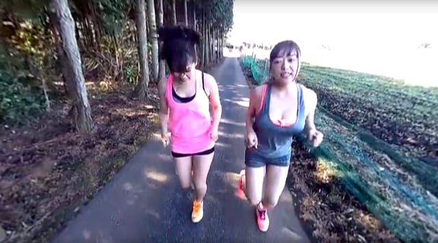 A gym trainer performs close contact in a VR POV video filmed outdoors with 180 degree perspective.